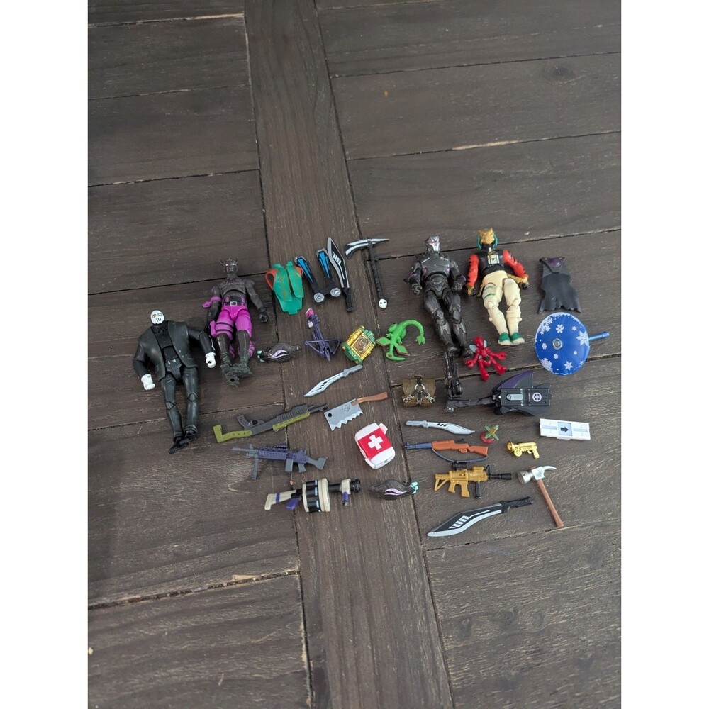 Lot Of Fortnite Action Figures And Weapons- Mini Action Figures And One 4"
